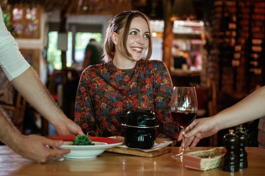 The, waiters brought the food. Woman is in the restaurant photo