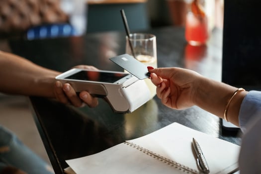 Woman, is paying for the service in the restaurant photo