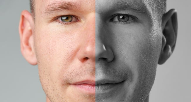 Portrait of a man showcasing a split-tone effect with one side in color and the other in black and white photo