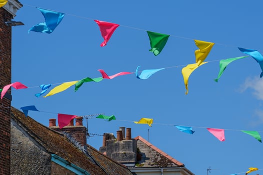 A blue sky with white clouds and banners in england photo