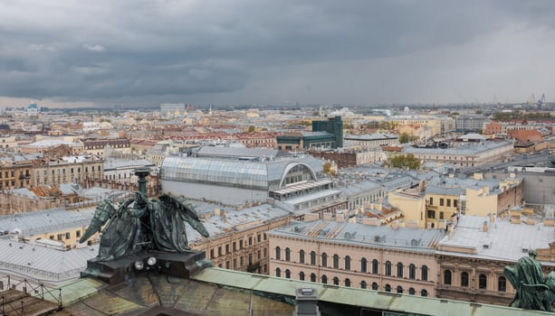 View of St. Petersburg Skyline With Dramatic Clouds and Historical Architecture During Overcast Afternoon photo