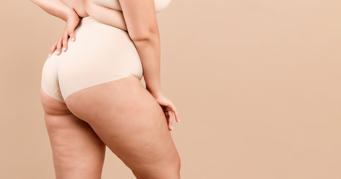 Plus Size Lady. Cropped Shot Of Unrecognizable Curvy Woman Posing In Underwear, Oversized Female Standing In Lingerie Over Beige Studio Background, Enjoying Her Natural Beauty, Panorama, Free Space photo