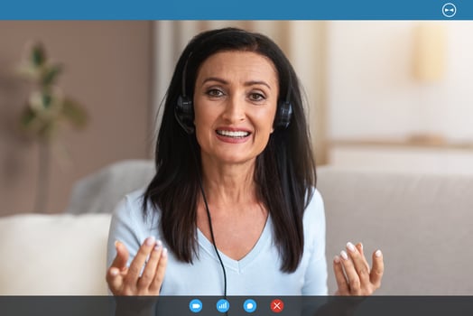 Conference. Portrait Of Senior Lady Wearing Headset Having Virtual Chat, Looking And Talking To Camera During Web Call, Explaining And Discussing Something In Headphones. Teleworking photo