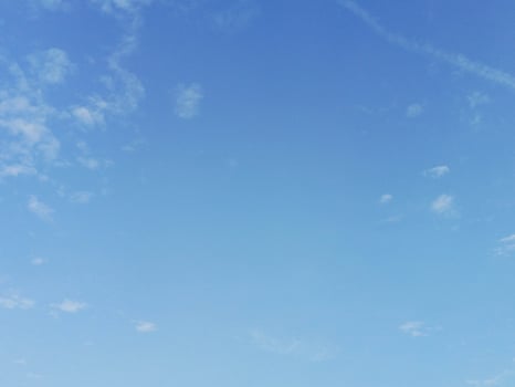Open Blue Sky with Few Clouds Backdrop - Serene Weather and Natu photo