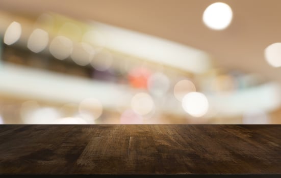 empty wooden table top over blurred background photo
