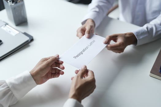 Business man sending resignation letter to boss. photo