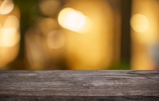wood table top and blur of restaurant background selective focus product display. photo