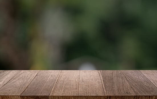 Empty wood table top and blur of restaurant background selective focus product display. photo