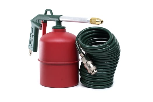 Green and Red Metal Tool with Coiled Hose on a White Background photo