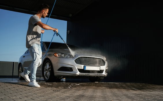 Service, of ,,car wash. Man is with his automobile outdoors photo