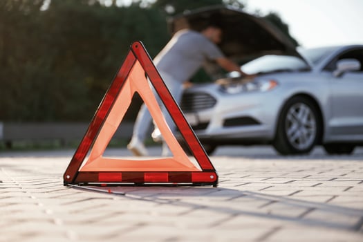 Unfortunate,, transport ,,is broken, red sign. Man is with his car outdoors photo