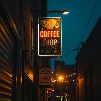 Coffee Shop Sign Glowing at Night in Urban Alley photo