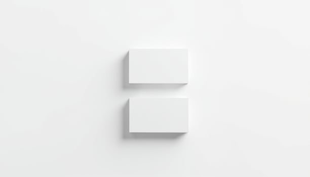 Three white boxes on a white wall photo