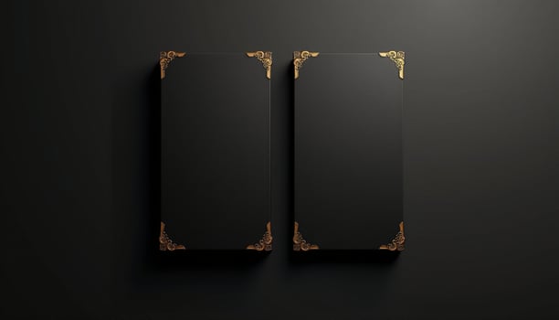 Two black and gold frames on a black background photo