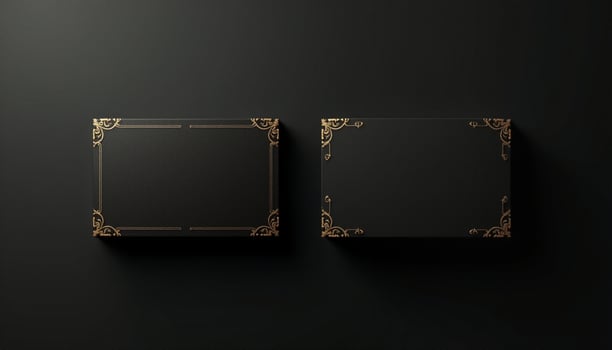 Two black square boxes with gold ornate design on the black background photo