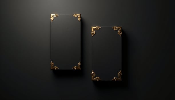 Two black and gold boxes on a black background photo