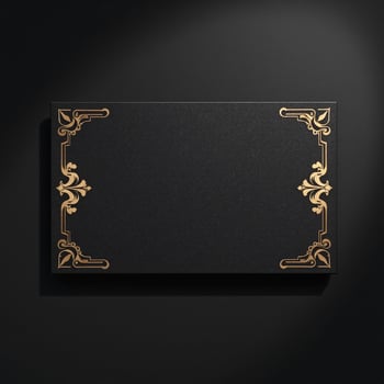 Black and gold card with ornate design on a black background photo