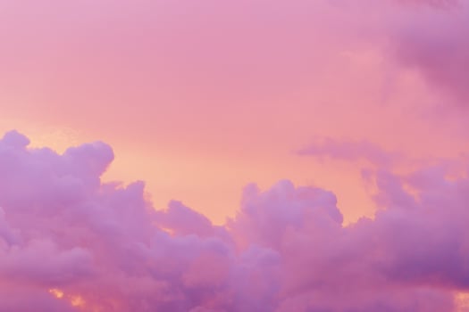 Pastel nature Sunset, purple fluffy clouds on pink colored sky, picturesque landscape pastel tones, soft colorful scenery with vanilla sky, beautiful sunlight lighting heaven in bright colors photo