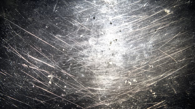 Distressed metal texture with scratches and grunge, showcasing an industrial aged abstract pattern photo