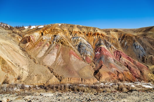 Fantastic mountain natural landscape with bright color transitions and blue clear sky Unearthly Martian landscapes. photo