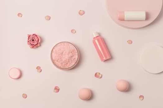 Aromatic crystals of sea salt with essential oil flower of rose. Spa composition with cosmetic bathroom product photo