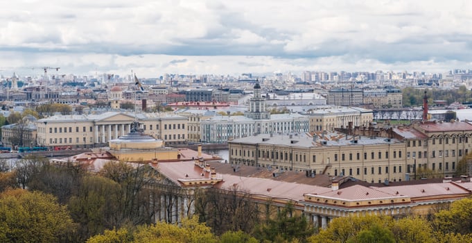 View of Historic Architecture and Cityscape in St Petersburg Under Cloudy Skies photo
