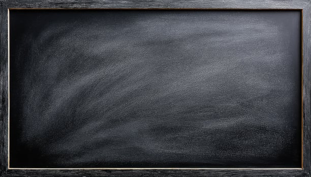 Dusty chalkboard surface with soft smudges educational context classroom environment close-up view photo