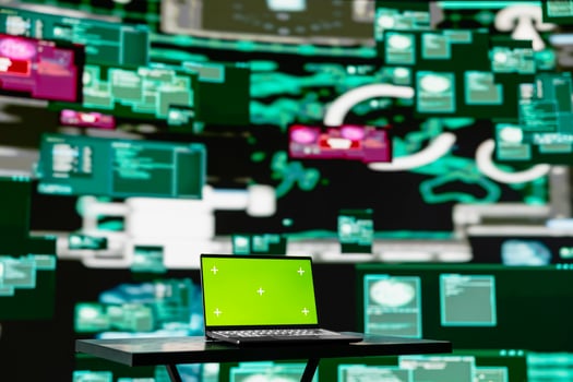 Empty scene with green screen on laptop showcases quantum threat on the dark web, space for a cyber crime with system override and identity theft. Cracking passwords to steal data. photo