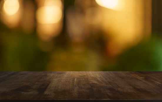 empty wooden table top on blurred background. photo