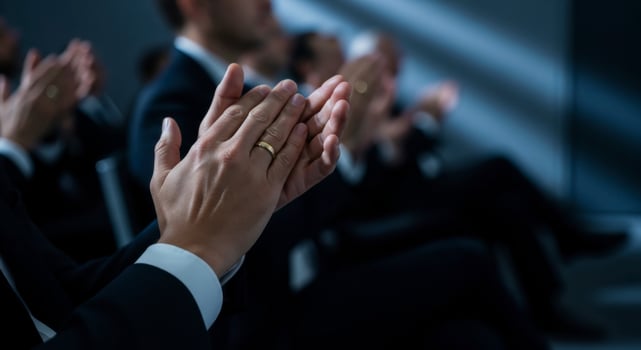 Close Up of Hands Clapping During a Business Conference or Professional Event photo