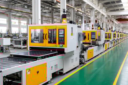Solar panel manufacturing process using automated machinery in factory photo