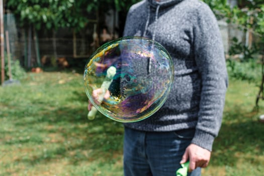 Soap bubble, outdoors activity and leisure for happy kid, real life photo