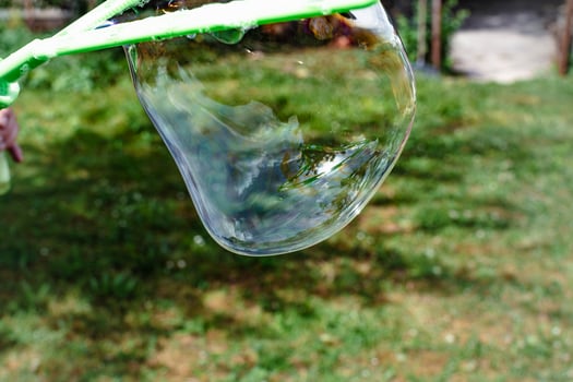 Soap bubble, outdoors activity and leisure for happy kid, real life photo, family photo