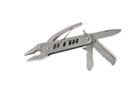 Stainless steel multipurpose tool showing pliers, knife and saw, isolated on white background photo
