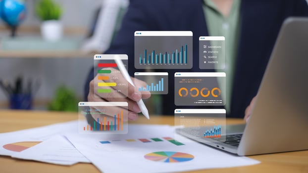 Human uses pen interacting with digital business analytics and reports. Symbolizes data visualization, financial performance, strategic decision-making. Corporate analysis, market trends, growth now. photo