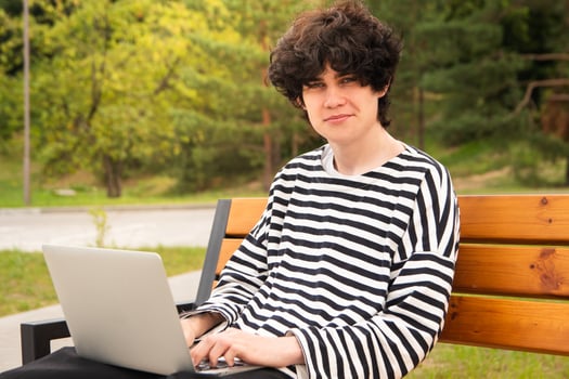Young freelancer enjoying outdoor workspace photo