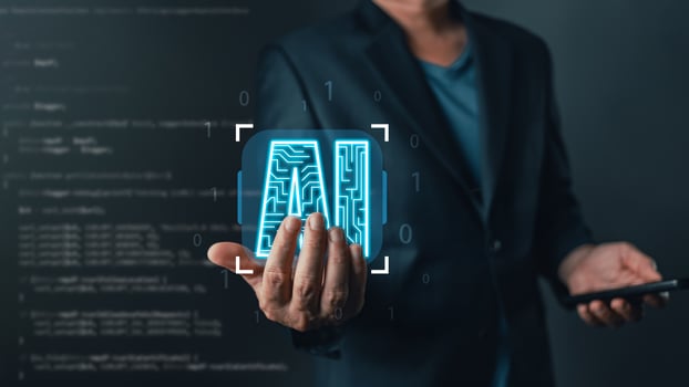 professional showcases a glowing AI icon, symbolizing artificial intelligence, innovation, and data-driven technology, emphasizing progress, modern solutions, and the future of digital transformation. photo