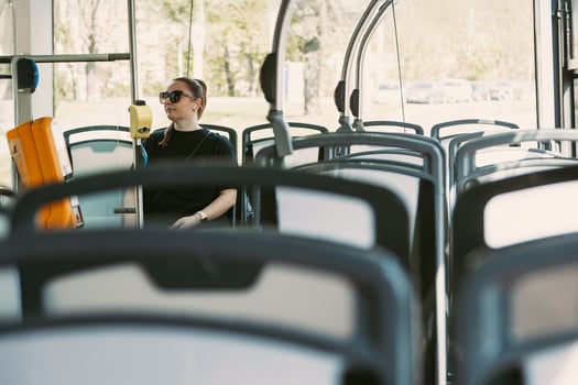 Woman commuting alone on modern city bus photo