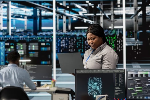 Data center engineer leverages artificial intelligence visualization tools to identify real time performance anomalies within server clusters and network segments, configuring hardware photo