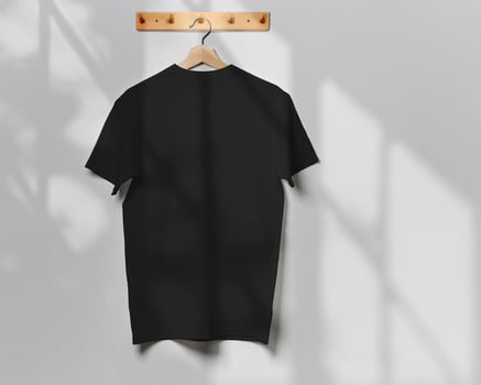 Black T-Shirt Mockup Back View Hanging on Wooden Wall Hook photo