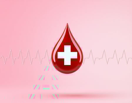 A blood drop with a cross on it photo