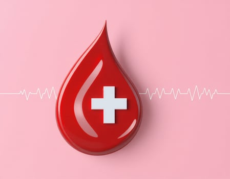 Blood drop with cross on it on pink background photo
