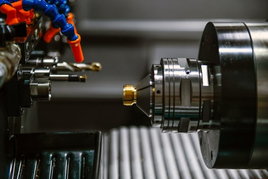 The CNC lathe machine thread cutting the screw metal shaft parts photo