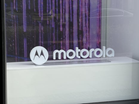 Warsaw, Poland - May 22, 2025 Motorola logo displayed prominently in a modern storefront, showcasing brand identity with sleek design elements and vibrant background visuals photo