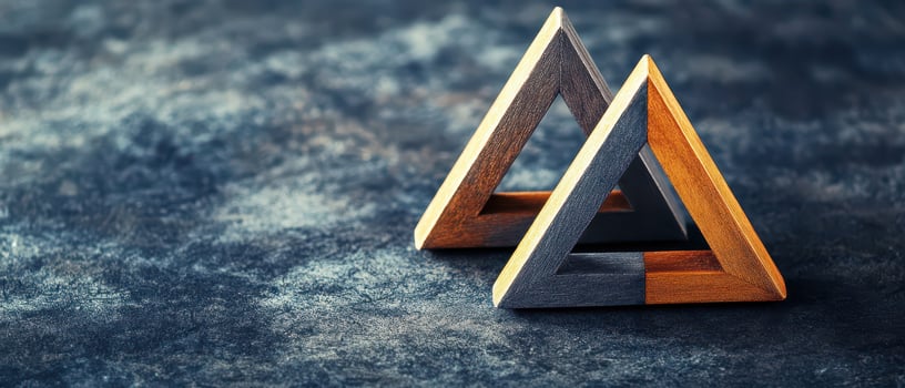 Wooden geometric shapes on textured surface photo