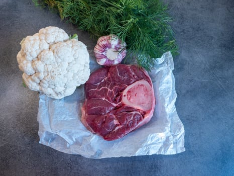 Raw Beef Shank with Bone Fresh Vegetabl on Parchment Paper photo