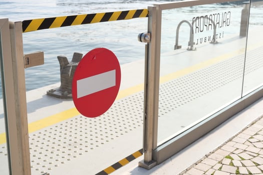 No entry sign on dock by waterfront in summer photo
