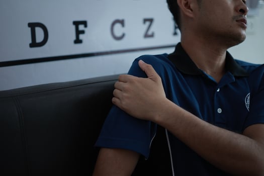 a man with a blue shirt and black pants photo