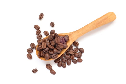 Coffee beans in spoon, brown roasted coffee beans in wooden spoon on white background photo
