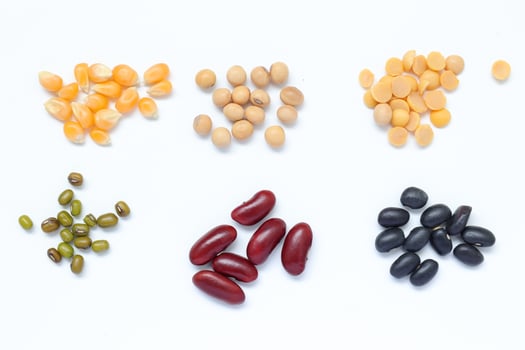 various types beans and beans on white background photo